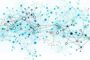 Magnifying glass and documents with analytics data lying on table