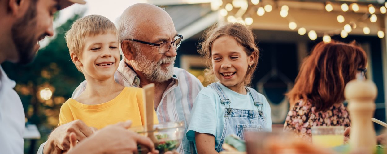 Happy,Senior,Grandfather,Talking,And,Having,Fun,With,His,Grandchildren,